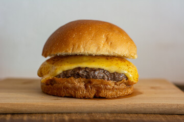 Classic cheeseburger with bread, patty and cheese.