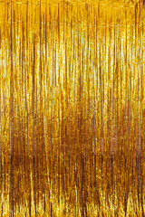 Golden background of golden tinsel