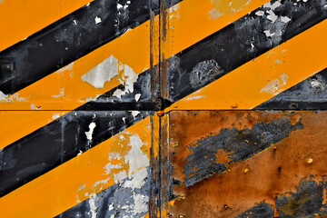 Differential weathering of chevron painted door. Three with normal weathering the forth completely...
