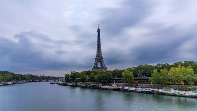 4K Timelapse Sequence of Paris, France - The Eiffel Tower from Day to Night as seen from the Pont de Bir-Hakeim