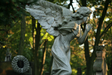 A tombstone sculpture at the Powazki (Pow¹zki) Cemetery, Warsaw, Poland
