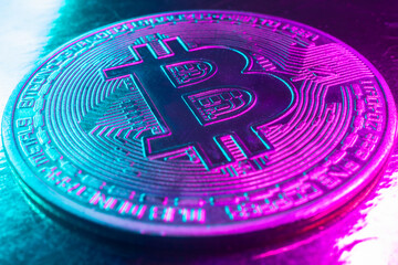bitcoin cryptocurrency concept neon light pink blue background