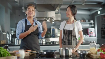Celebrity TV Cooking Show Kitchen: Asian and Black Female Chefs Talk, Teach How to Cook Food. Online Video Courses, Television Program Presenters. Preparation of Healthy Traditional Fusion Dish Recipe