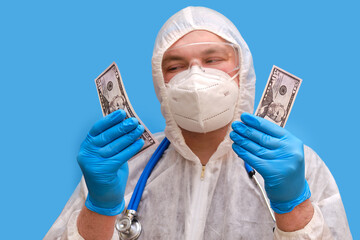 Man doctor medic in a protective suit uniform with goggles and face mask on a studio blue background. Paramedic in white antiviral protective clothing wearing an N95 respirator and safety glasses