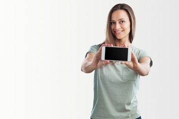 Portrait photo of young beautiful woman feeling happy or surprise shock and holding smart phone