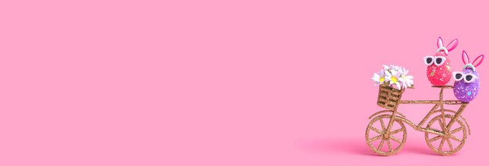 Easter composition on a pink background, an egg with rabbit ears and sunglasses, closeup with copy space