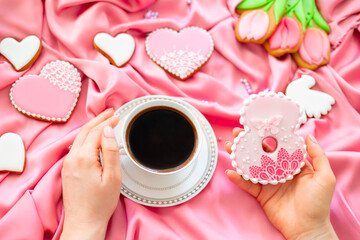 background banner greeting card for international women day with eight number and cup of coffee in woman hands, tulips and pigeon shape gingerbread cookies on silk fabric background