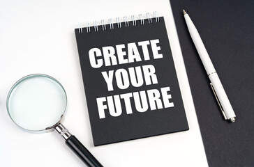 On a black and white surface lies a magnifying glass, a pen and a notepad with the inscription -...
