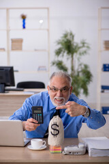 Old male employee in remuneration concept