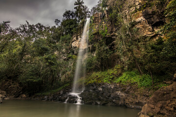 Sutile water drop in Cataratas del Iguazú National Park, called Salto Escondido (hidden jump) between the jungle forest in Iguazú, Misiones, Argentina
