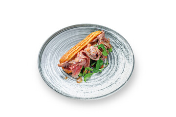 Homemade beef meat sandwich in croissant with lettuce, tomato and arugula leaves in a plate on a white isolated background. Place for text. Fast Food. Menu layout image