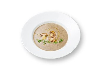 Mushroom puree soup with champignons in a plate on a white isolated background