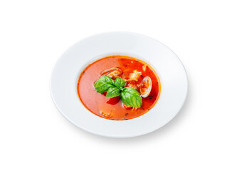Tomato soup with mussels and basil on a white isolated background