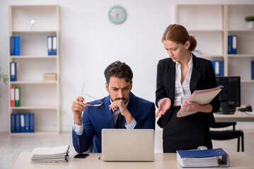 Two colleagues working in the office