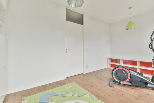 Interior of room with elliptical trainer