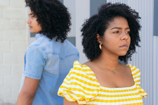 Offended Hispanic partners turning away from each other