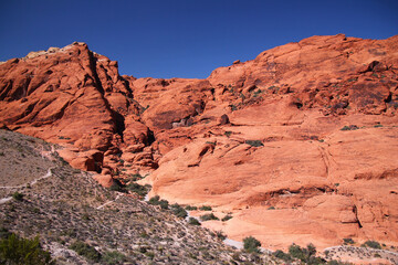 The Red Rock mountains with the peaks on the clear blue sky in the Canyon