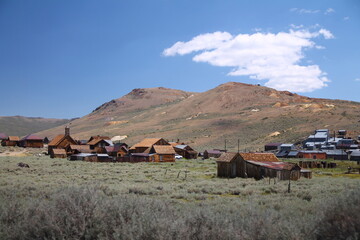 The beautiful ruins of the gold rush city of Bodie with the mountains and the desert