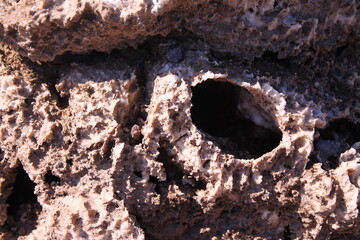 The hole on the salt and rock formation of the Devils Golf Course in the Death Valley
