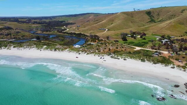 Car driving along Snelling Beach and Middle River on the North Coast of Kangaroo Island, South Australia. Wide angle aerial