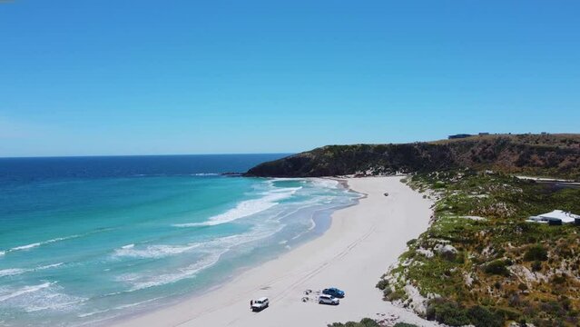 Cars parked on Snelling Beach on the North Coast of Kangaroo Island, South Australia. Rising aerial shot