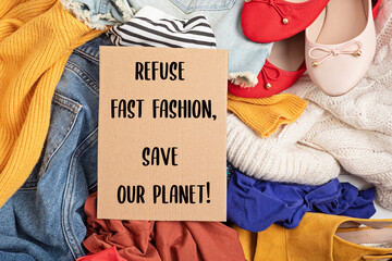 Fast fashion background with pile of cheap, low quality clothes. Garment made in unjust, inhumane...