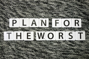Words plan for the worst on dark background. Risk management strategy and planning for potential...