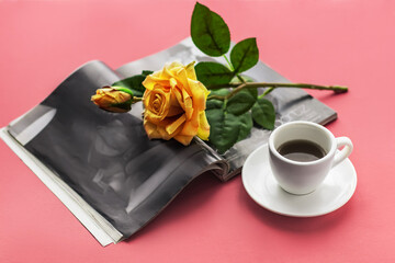 Obraz na płótnie Canvas Romantic atmosphere.Cup of coffee and a rose on a magazine on a pink background.Concept for a greeting banner happy birthday, mother's day, valentines day. Lifestyle.