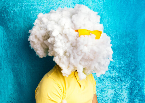 Young careless man with huge cloud of cotton on head