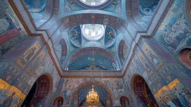 The magnificent ceiling and dome of the orthodox cathedral. Action. Bottom view of the church interior, concept of religion and architecture.