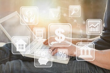 Businessman using a computer to fund financial investment management portfolio diversification