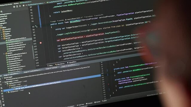 Writing programming code on laptop. Web site codes on computer monitor.