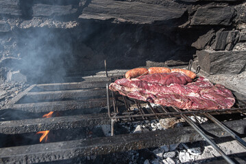 Typical Uruguayan and Argentine Asado Cooked on fire. Entrana and Vacio meat cuts. Accompanied with Chorizo.
