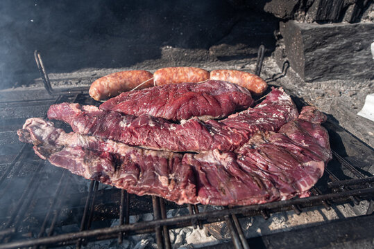 Typical Uruguayan and Argentine Asado Cooked on fire. Entrana and Vacio meat cuts. Accompanied with Chorizo.
