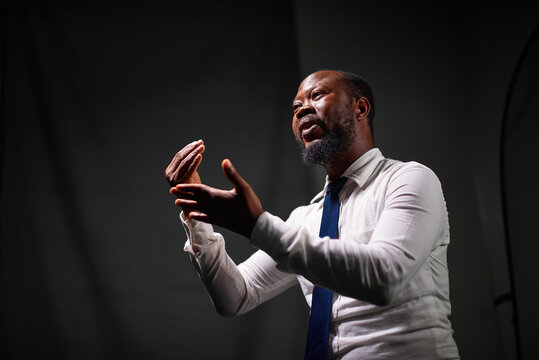 Man speaking with sign language in a studio