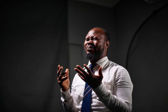 Man speaking with sign language in a studio