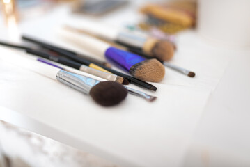 Makeup brushes, after use, on a napkin.