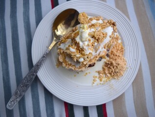 Cold meringue on the plate with spoon.