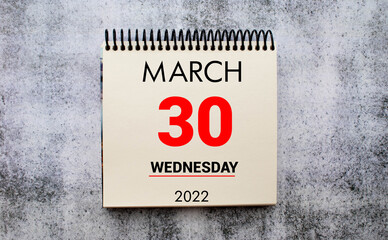 30 March 30 March in the calendar on a wooden background