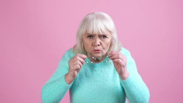Outraged granny scolds grandchildren isolated pastel color background