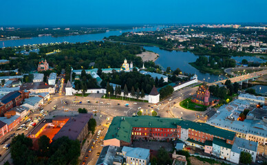 Cityscape of Yaroslavl with view of Transfiguration Monastery and Epiphany Church in evening.