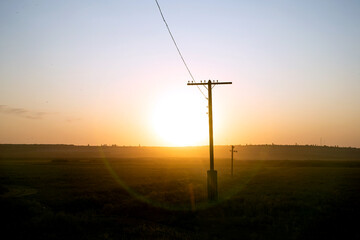 Fototapeta premium Beautiful sunset on the green hills in the countryside