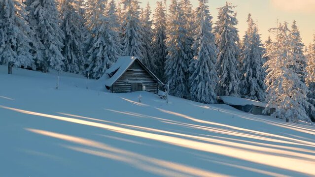  shepherd's house winter after storms and hurricanes and in the Carpathians and Alps, fabulously beautiful and very unusual patterns of snow and ice on the slopes against the background of the peaks