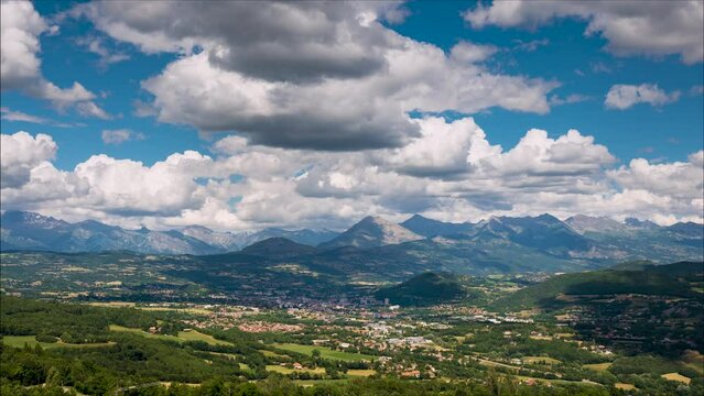 Timelapse of the city of Gap in Summer with view of the Ecrins National Park mountain range in the distance. Hautes-Alpes (French Alps), France