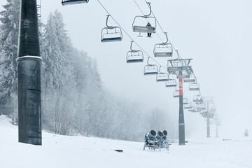Ski lifts in the winter forest