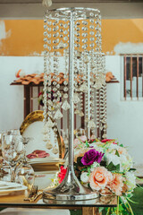 details of flowers and cups on top of a decorated table