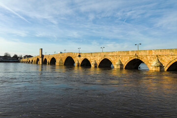 Fototapeta premium SVILENGRAD, BULGARIA - JULY 19, 2020: Sixteenth century Mustafa Pasha Bridge (Old Bridge) over Maritsa river in town of Svilengrad, Haskovo Region, Bulgaria