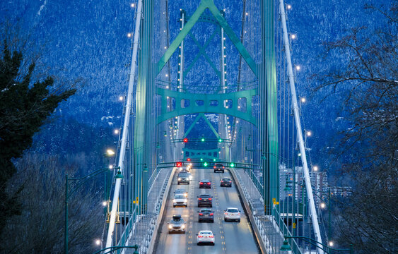 Closeup View of Lions Gate suspension Bridge in Vancouver, British Columbia, Canada at night in winter full of lights - Powered by Adobe