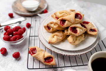Kolacky with Cream Cheese and Raspberry. Pastry with jelly and cream.  Polish Kolaczki cookies,...