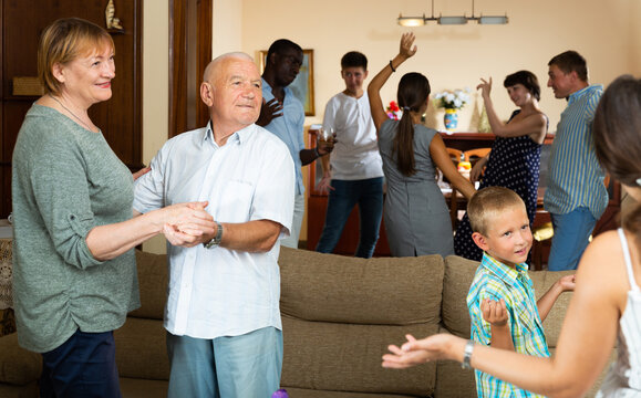 Grand family party - dancing in room at home. High quality photo
